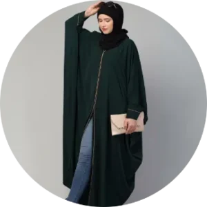 a woman in a green front open abaya